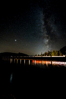 Milky Way and headlights over Lake Minnewanka