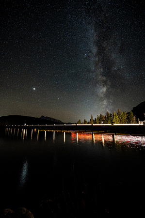 Milky Way and headlights over Lake Minnewanka